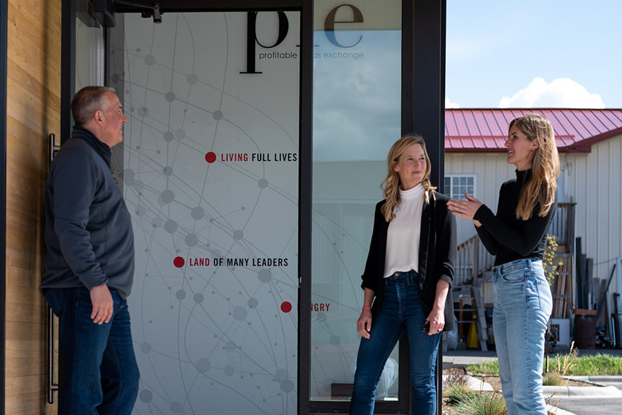 PIE team member talking in front of building